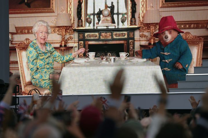 The crowd watching Queen Elizabeth II having tea with Paddington Bear on a big screen during the Platinum Party at the Palace on June 4, 2022.