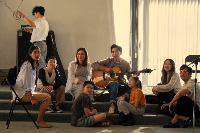In "Beef," protagonists often meet at a local Korean church. Cast members include, seated from far left, Andie Ju as Esther, Alyssa Gihee Kim as Veronica, Justin H. Min as Edwin (with guitar).